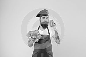 Who cares about diet. cook hold fresh salad and smoothie in bottle. organic eco vegan products. bearded man chef in