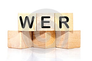 Who, German word for Who, (German: Wer) inscription on wooden cubes on a white background