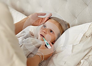 For he who has health has hope. a woman taking her little girls temperature with a thermometer in bed at home.