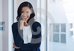 Those who keep dreaming keep on succeeding. a young businesswoman looking thoughtful in an office.