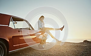 Who knew a solo road trip could be this fun. a young woman enjoying a road trip along the coast.