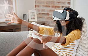 Who needs friends. a young girl playing with a vr headset at home.