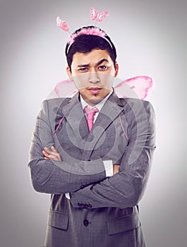 Who says fairies cant do business. A cropped shot of a businessman dressed as a fairy.