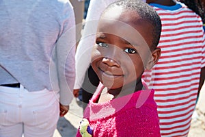 This is who weve gotta reach. Cropped portrait of a young child at a community outreach event.