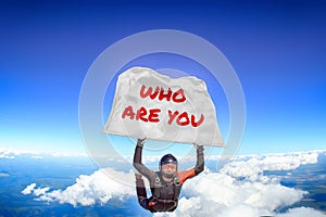 Who are you. Flag in skydiving. People in free fall.Teampleat skydiver. Extreme sport.