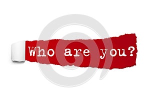 Who are you question written under the curled piece of Red torn paper