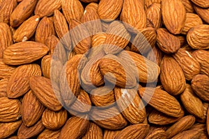 Whole almond nuts background. Vegetarian healthy snack. Organic food. Vegetable diet.