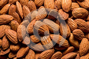 Whole almond nuts background. Vegetarian healthy snack. Organic food. Vegetable diet.