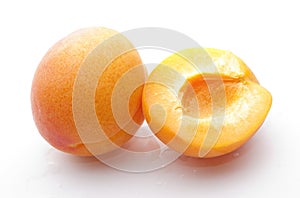 Whole apricot and half close-up