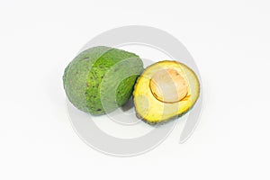 Whole avocado and cut half on white background