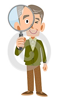 Whole body of a senior man looking through a magnifying glass