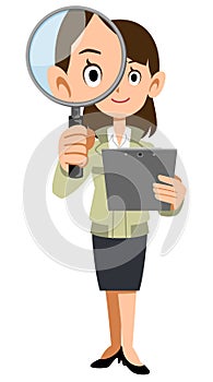 The whole body of a woman in a construction shop holding documents and looking through a magnifying glass