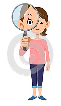 The whole body of a woman looking through a magnifying glass