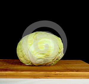 Whole cabbage towards black