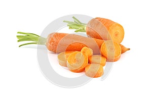 Whole carrot and its sliced pieces isolated against a white background