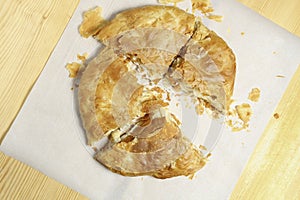 whole cheese pie cut in pieces