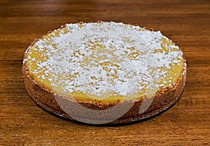 A whole cheesecake resting on a table