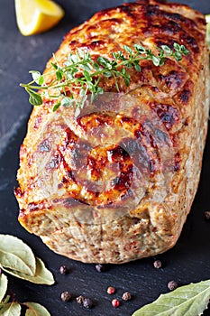 Whole chicken meatloaf on a slate tray