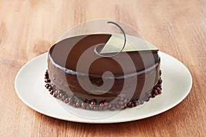 Whole chocolate cake on a dish