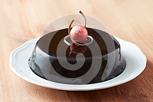 Whole chocolate cake on a dish