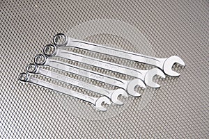 Whole chrome-plated wrenches and metalic background