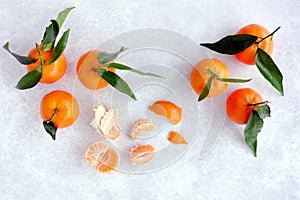 Whole Clementines with Leaves, Peel and Segments. Horizontal Version