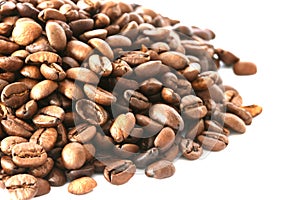 Whole coffee beans on white background