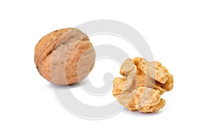 Whole and cracked walnut on the white background