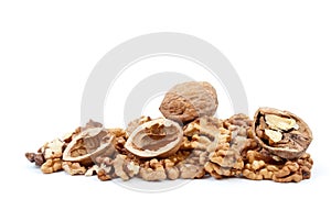 Whole and cracked walnuts, nutshells, kernels