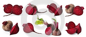 Whole and cut boiled red beets on white