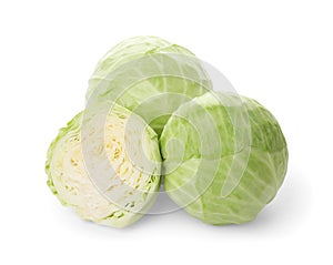 Whole and cut fresh ripe cabbages on white