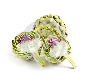 Whole and Cut Globe Artichokes on White Background