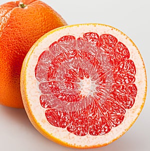 Whole and cut grapefruits