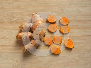 Whole and cut Turmeric root