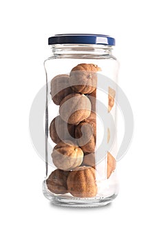 Whole dried limes, sun dried fruits in a glass jar with lid