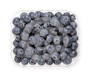 Whole fresh blueberries, ripe and dark blue fruits, in a clear plastic punnet