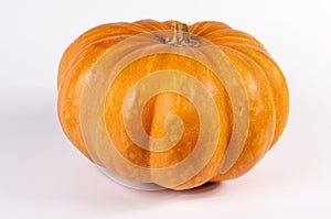 Whole fresh orange big pumpkin on white background, closeup. Organic agricultural product, ingredients for cooking