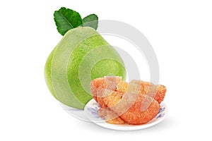 Whole fresh pomelo fruit and pealed pomelo on white plate with clipping path