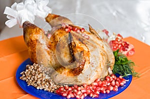 Whole fried chicken with buckwheat and pomegranate