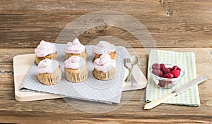 Whole garin cupcakes with cheese cream and fresh raspberries