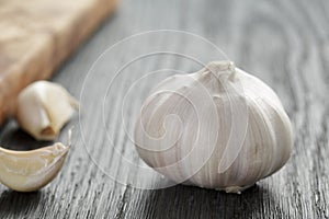 Whole garlic head on oak wood table