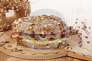 Whole grain bagel with bacon.