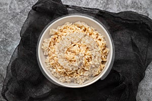 Whole grain brown rice cooked in small bowl