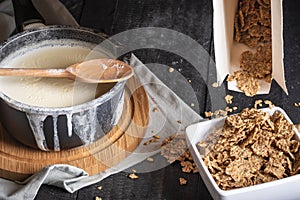 Whole grain cereals and milk in a saucepan