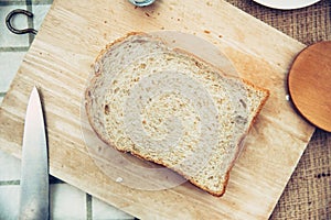 Whole grain wheat bread top view rustic on wooden table