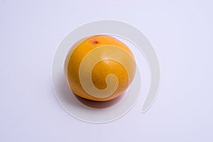 Whole grapefruit isolated on white