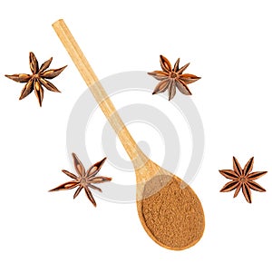 Whole and ground star anise in a wooden spoon