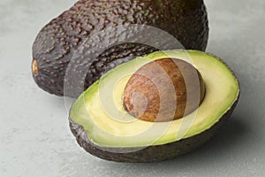 Whole and half avocado fruit