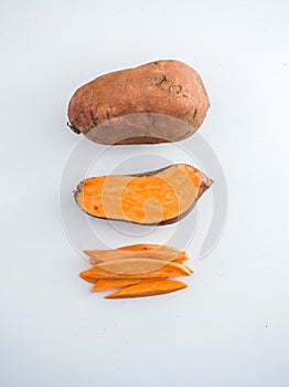 Raw sweet potato isolated on white photo