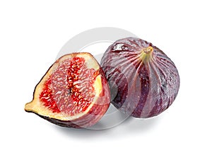Whole and half cut figs close-up isolated on  white background